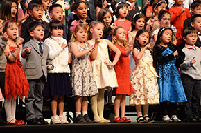 Lower school students singing on stage