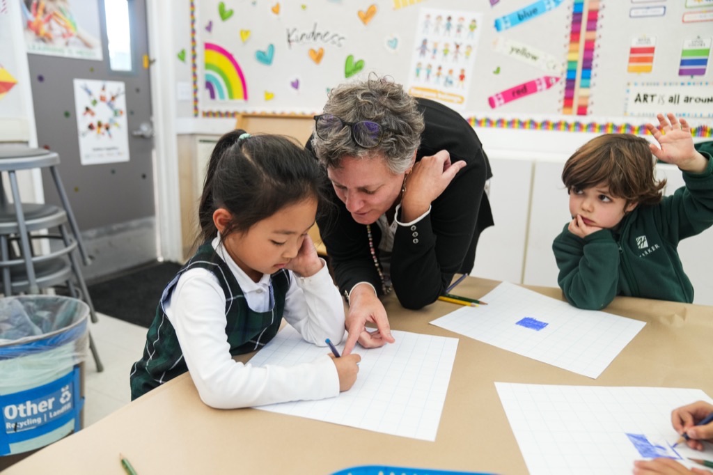 Lower school students working with a visiting artist in residence