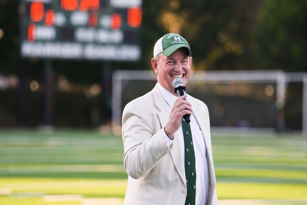 Brian Yager, head of school, speaking at a Harker football game